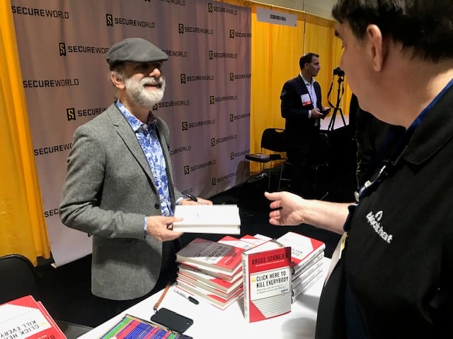 Bruce_Schneier_signs_books_BOS19