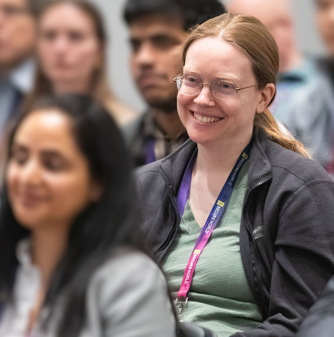 ABOUT_US_Audiences_woman_attendee_smiling_boston2026-027