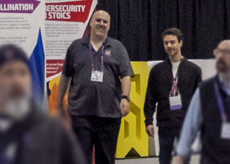 ABOUT_US_Hallway_two guys talking and walking between sessions _053